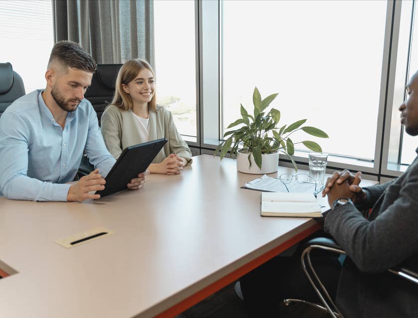 A man and woman interviewing a potential employee.