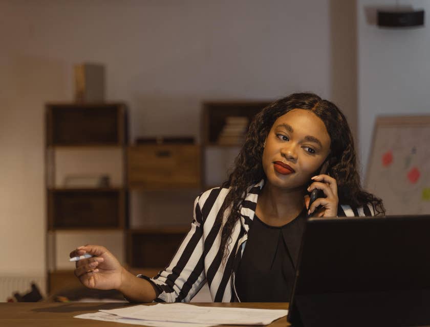 A female HR associate communicating on the phone.