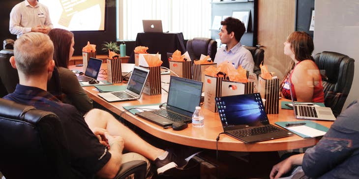 An HR Business Partner having a meeting with department managers.