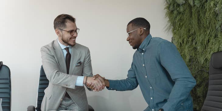 An HR manager congratulating an applicant.