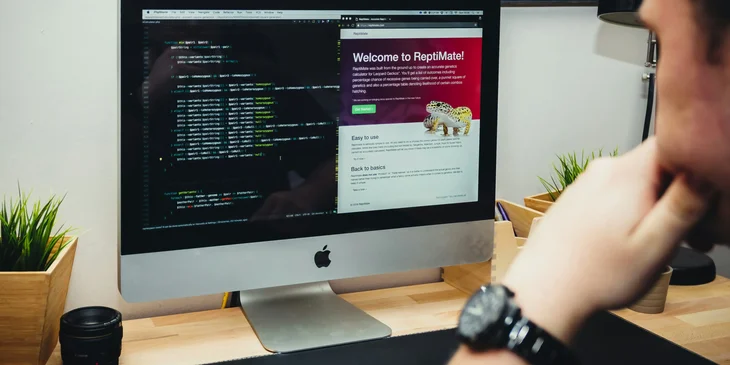 An HTML developer making adjustment to a client's website design.