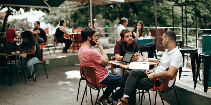 Independent Sales Associate having a meeting outside with potential customers