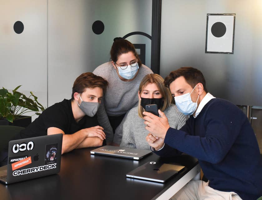 Independent Sales Representative showing photos of previous successful customers to the clients to persuade them into buying the company's services and products