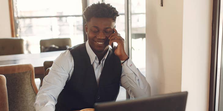 Inside Sales Representative talking to a potential customer via phone while having a coffee