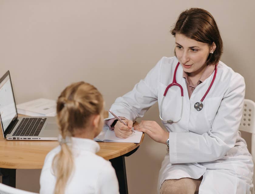 Internist consulting with a patient to understand her health concerns.