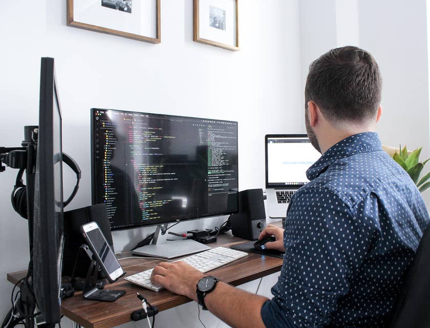 IT Engineer monitoring the network system of the company at his workstation