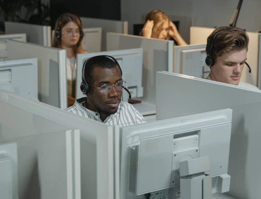 a team of IT Support Engineers taking in troubleshooting calls over the phone regarding network issues