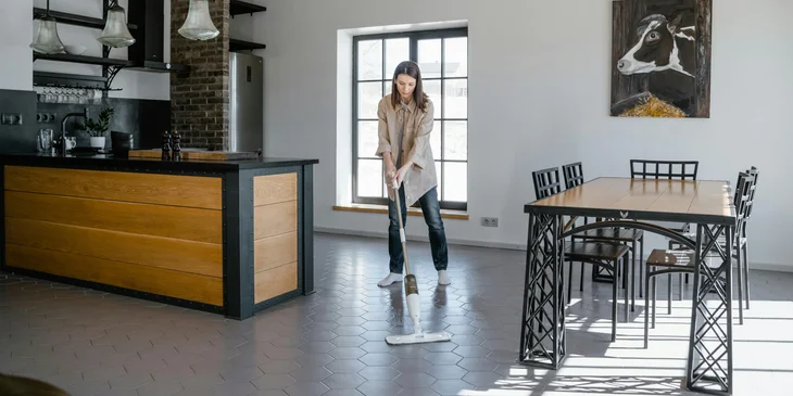 A janitor mopping a floor.