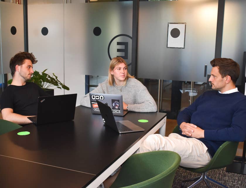 a team of Java Architects deliberating on a new design system they will be working on