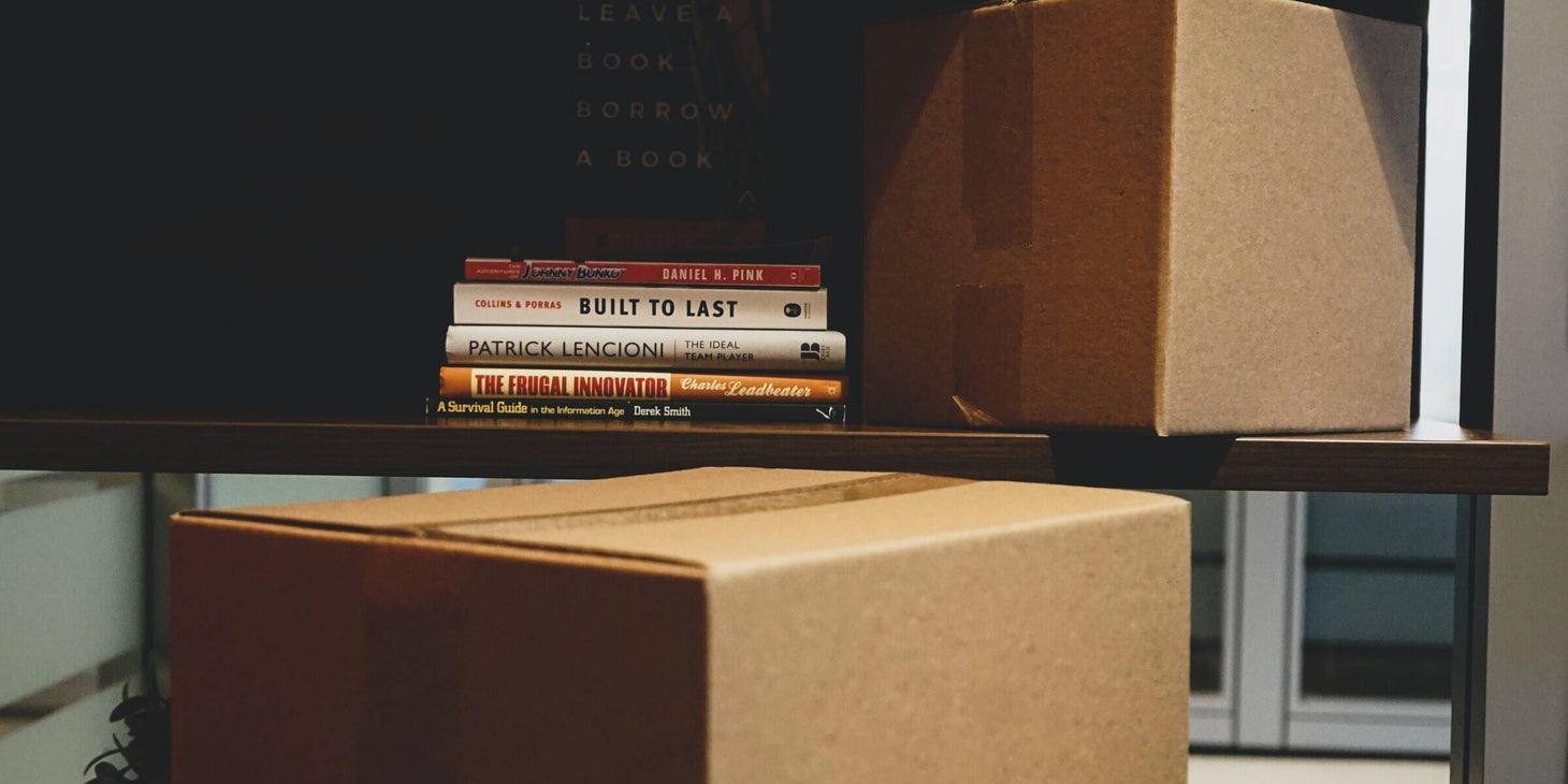 A desk that is being cleared out.