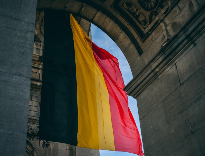 Belgium flag hanging in an archway.