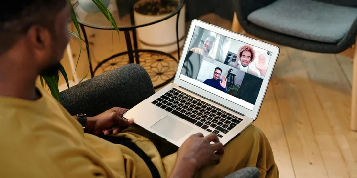 A job coach on a video call with clients to help them prepare for their job interviews.