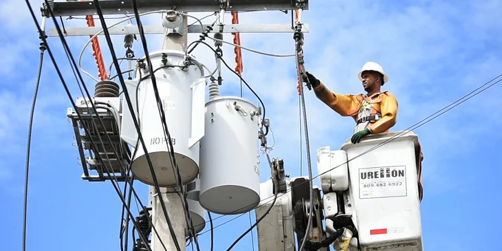 A journeyman lineman working on power lines.