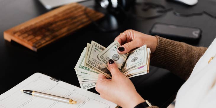 Leasing agent Job counting the money that the client gave as rent payment