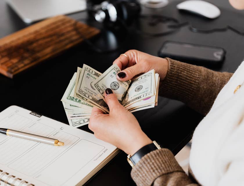 Leasing agent Job counting the money that the client gave as rent payment