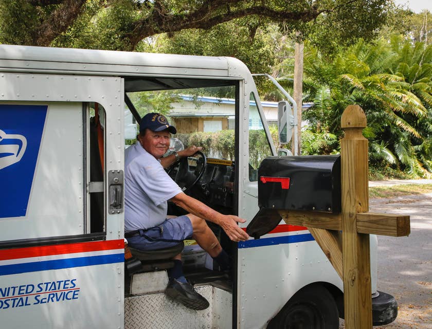 Postman sitting in postal truck.