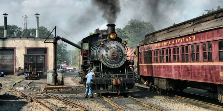 A locomotive engineer performing inspections on a locomotive upon arrival.