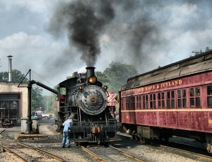 A locomotive engineer performing inspections on a locomotive upon arrival.
