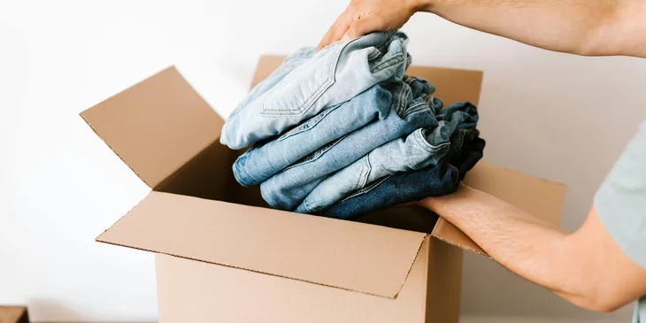 A logistics assistant checking newly delivered packages to ensure amount is correct.