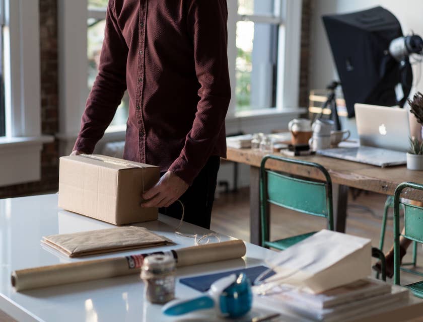 Mail processing clerk sorting different types of mail