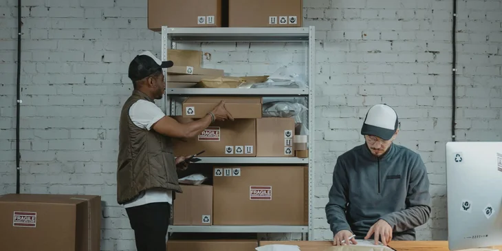 A mail sorter checking different kinds of mail.