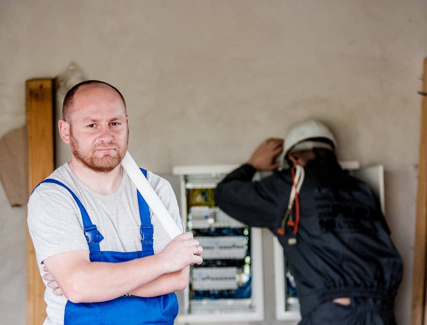 Maintenance Manager supervising electrical repairs.
