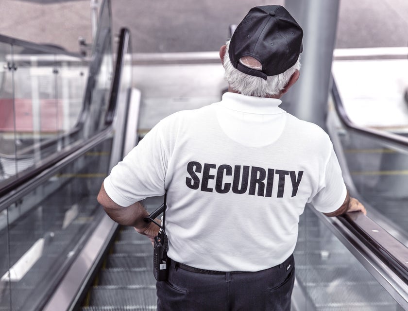 security guard on a mall escalator