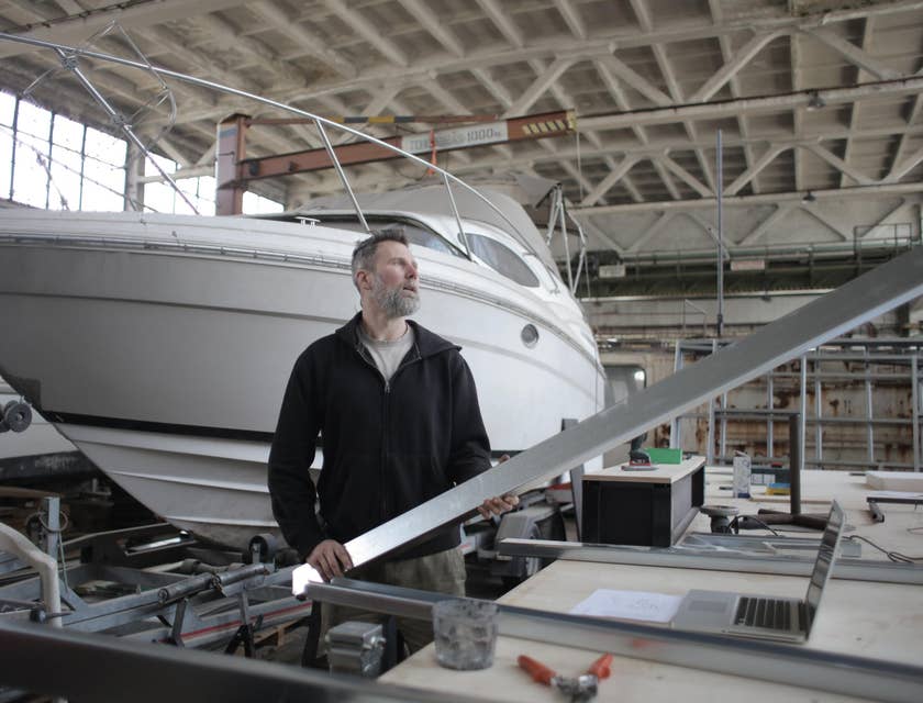 Marine service technician repairing a boat