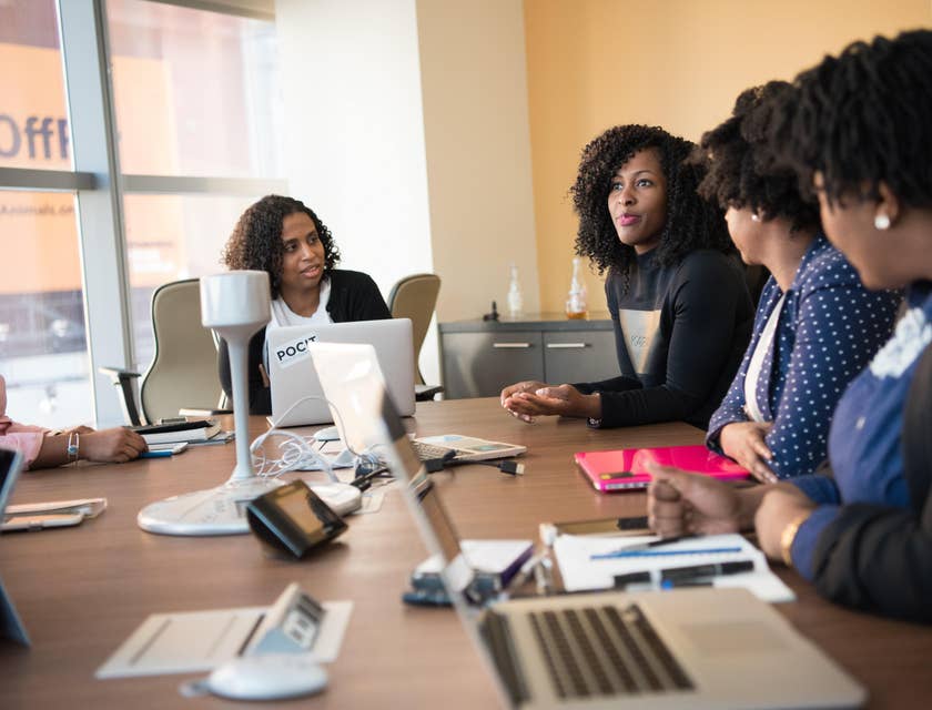 a group of marketing managers discussing their company's target marketing goals to the marketing consultant