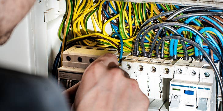 Master electrician fixing a panel board.