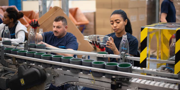 A material planner checking and inspecting and ensuring that the materials are meeting company's quality standards.