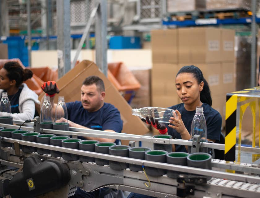 A material planner checking and inspecting and ensuring that the materials are meeting company's quality standards.