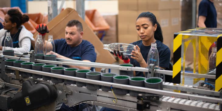 A material planner checking and inspecting and ensuring that the materials are meeting company's quality standards.