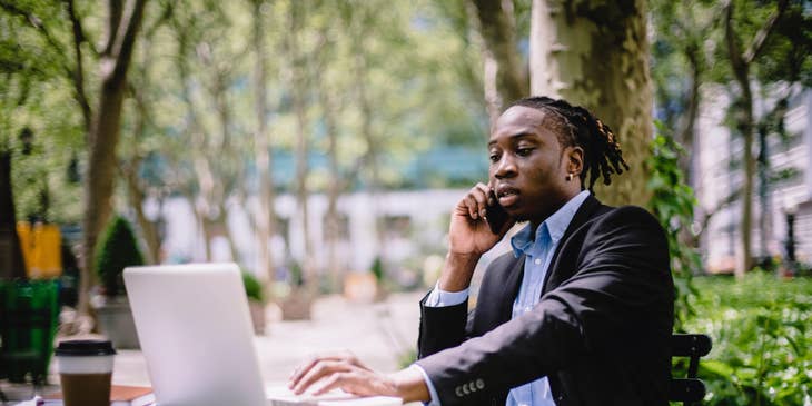 Media director calling his media manager and discussing the next set of advertisement campaigns for their clients.