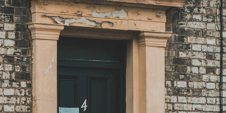 A messenger about to knock on a client's door and hand over a parcel to a client.