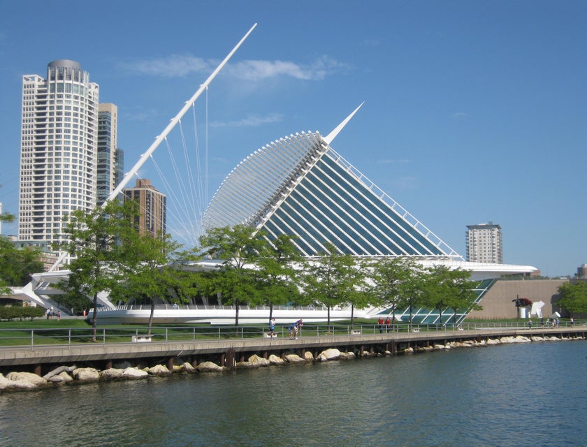 A waterside scene of buildings and greenery in Milwaukee, Wisconsin.