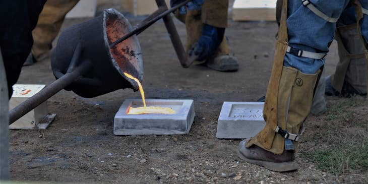 Mold maker doing an iron pour over molds