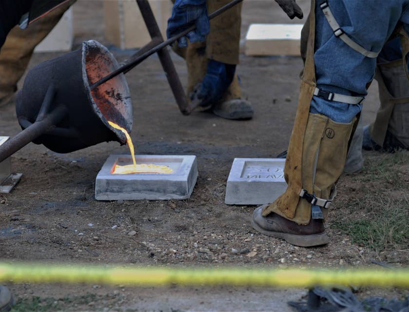 Mold maker doing an iron pour over molds