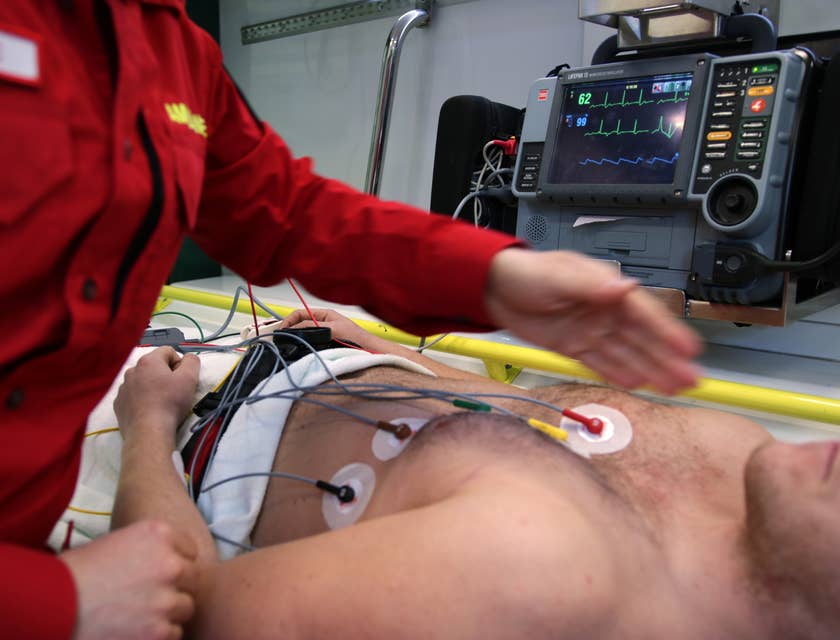 Monitor technician attaching electrodes to the patients' bodies.