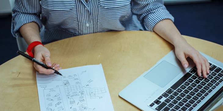 Multimedia designer doing a rough sketch design for her client's new project.