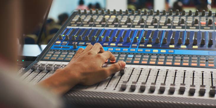 Music editor mixing the band's latest single.