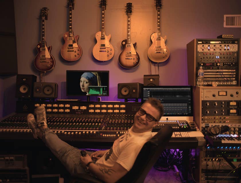 A music producer chillin inside his studio.