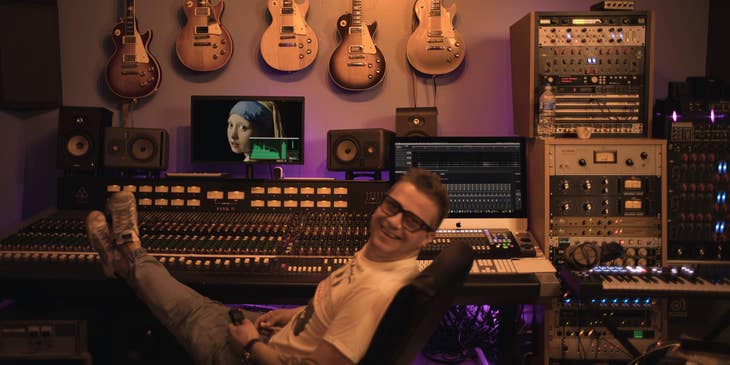 a music producer chillin inside his studio.