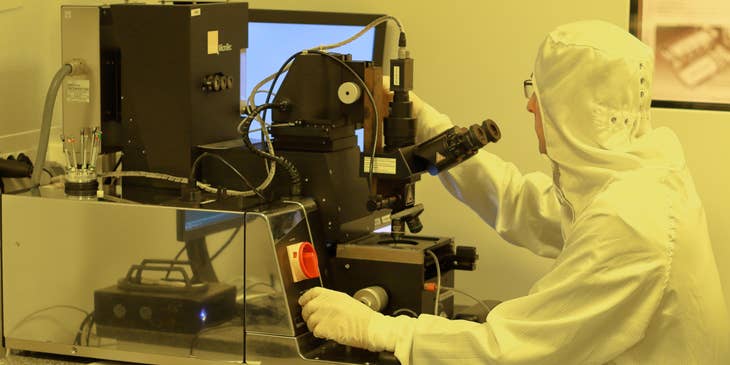 Nanosystems engineer checking the results of his experiment inside the cleanroom.