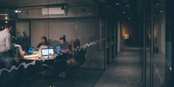 A team of network analysts working on their presentation regarding the company's network analysis
