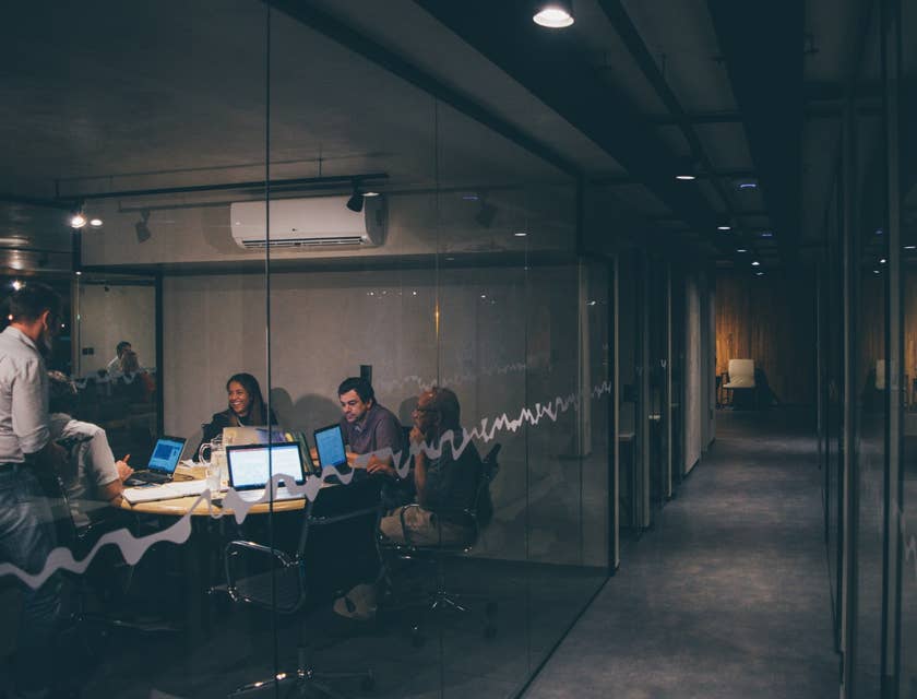 a team of network analysts working on their presentation regarding the company's network analysis