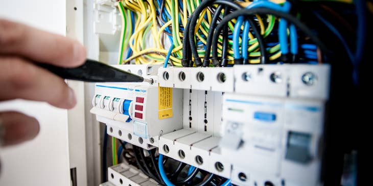 Networking specialist repairing a part of the company's server.