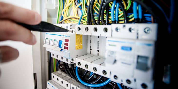 Networking specialist repairing a part of the company's server