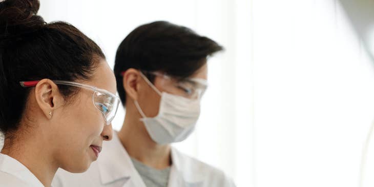 Neuroscientist leading assistants in clinical work.