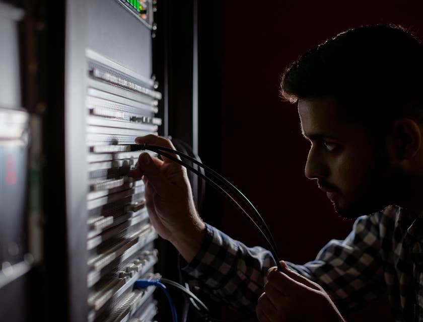 NOC technician looking into a server at the data center